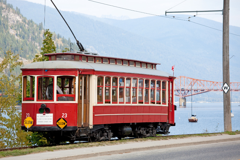1923 streetcar passing along the waterfron of the Kootenay River, Nelson BC